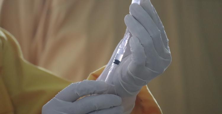 Person holding a vaccine