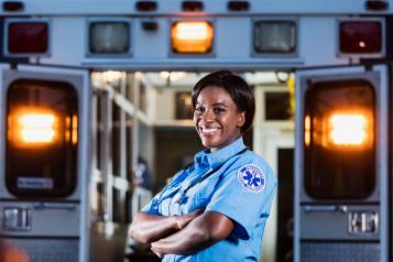 Woman at the back of an ambulance