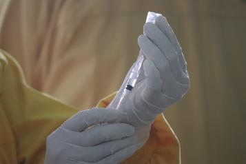 Person holding a vaccine